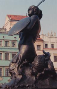 With sword and shield, the Warsaw Mermaid guards the Old Town district.