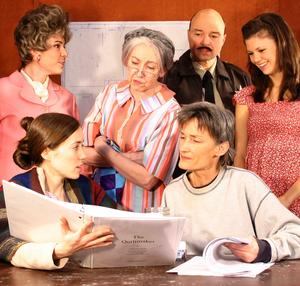 Catherine Bush, seated right, works with some of the cast members of The Quiltmaker, her current Barter production.