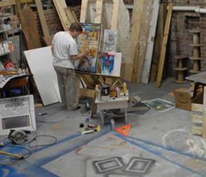 One of the artists selected for the 2007 show, Lee Coburn, paints in his Glade Spring studio.