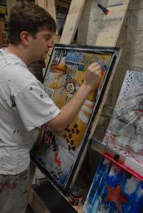 Lee Coburn paints in his studio in Glade Spring, Va.