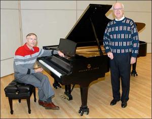 Dr. Ben Caton, left, and Dr. Frank J. Grzych show a new Steinway model D piano in the ETSU music department. <em> (Photo by Ron Campbell|Johnson City Press)</em>