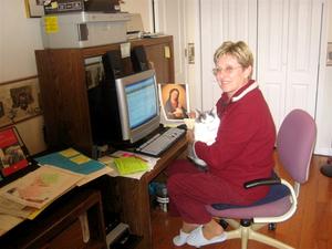 McCoy's cat Buddy "helps" her with her work.