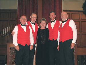 Beth McCoy, center, artistic director of MECCA and director of HYE, takes a bow with members of the barbershop quartet: from left, James Hughes, tenor; Henderson Hood, lead vocals; Brett Pryor, bass; and Pete Leuck, baritone.