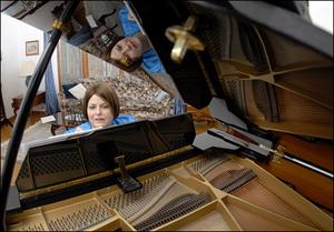 The "Sounding Board" article was written by Evelyn Pursley-Kopitzke, a composer, church musician, and teacher in Blountville, Tenn. (Photo at her piano by Tom Duncan, Johnson City Press)