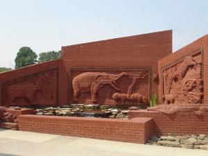 Outside the Natural History Museum at the Gray Fossil Site is a brick sculpture entitled "The Watering Hole." The sculpture is so named because the fossil site is most likely where prehistoric creatures regularly gathered to drink or to stalk their prey.