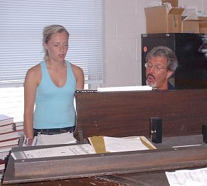 Hannah Dishman practices with her voice coach, Mark Davis. The Bristol, Va., 17-year-old recently won the top prize in a statewide music scholarship competition for singing an Italian opera. (Photo By Shana Hoilman/Special to the Herald Courier)