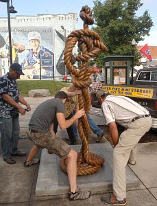 "Feminine Entwinement" by Bristol, Tennessee artist Val Lyle is moved into place near the Country Music Mural on State Street. (Photo By David Crigger|Bristol Herald Courier)