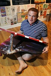 Nicholas Ratcliff poses with a piano sculpture that he made while attending the Governor's School. (Photo by Andre Teague|Bristol Herald Courier)