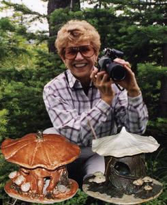 Alma Rigby loves to photograph nature, and to create ceramic fairy houses and bird houses, foreground.