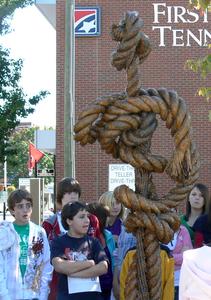 Advanced art students from Vance Middle School in Bristol, Tenn. discuss Val Lyle's "Feminine Entwinement," which won the People's Choice award in the Art in Public Places outdoor sculpture exhibition in downtown Bristol, TN/VA. The tour was led by Dr. Marvin Tadlock, professor of art at Virginia Intermont College, whose sculpture "Coca-Cola" won last year's competition in Bristol. For walking tour information, interested teachers or groups may call 423-612-9447 or email candy@aippbristol.org.