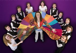 Joseph (Ben Mackel) is surrounded by members of the East Tennessee Children's Choir who perform in the Barter Theatre production of "Joseph and the Amazing Technicolor Dreamcoat."