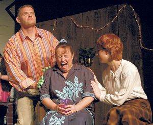 Teddy (Mike Locke) is in shock while Pearl (Lindsay Atwood) consoles Joyce (Terri McCall) in a scene from Theatre Bristol's <em>Trivial Pursuits,</em> on stage through March 29, 2009.