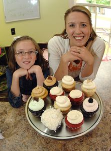 Natalie Shortridge and her daughter Morgan, 9, show off samples of the merchandise available at Babycakes Cupcakes in Abingdon. (Earl Neikirk/Bristol Herald Courier)