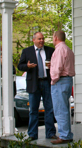 William King Museum Director Lemont Dobson, right, (in suit and tie) chats with Abingdon Town Councilman Jason Berry in front of Blue Windmill Galleries in Abingdon, Va.