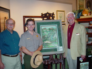 Shown with P. Buckley Moss's "The Good Road" are Parkway officials. From left are Phil Francis, superintendent; Shawn Rhodes, volunteer coordinator; and Dan Brown, former superintendent and 75th Anniversary Committee President. 