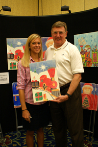 Artwork by Aubrey Baker, left, will be made into banners and yard flags to be displayed in Kingsport. Shown with Aubrey is Tennessee State Representative Tony Shipley.