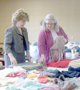 Janet Woolwine and Sharon Reed sort through completed creations. 