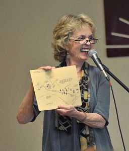 Lee Smith uses a hand-drawn map to illustrate one of her stories during a program at the Bristol Public Library. (Photo by Earl Neikirk|Bristol Herald Courier)