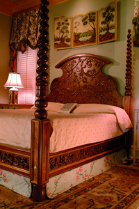 Joel Harte's talent is in the details. Examples of his carving and marquetry are shown in the four-poster bed. (Photo by Hank Daniel)