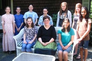 From left (seated), Tess Drzymala, Dr. Lisa Withers, Urmila Bharathan; (standing) Grace-Marie Mills, Sarah-Dale Mills, Charlotte DeForest, Natalie DeForest, Molly Deegan, Carrington Austin, and Alisha Freitas. Not pictured: Paris Eve Reinhard.