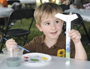 Simeon Castonguay was among 200-plus kids who painted rockets at Porterfield Square (Barter Green). Photo by David Crigger/Bristol Herald Courier