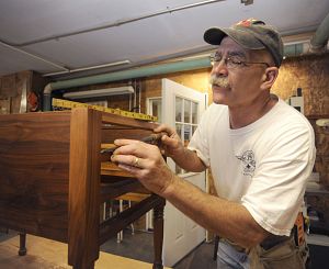 Joe Cress works on a Rockbridge Table in his shop in Washington County, Va.