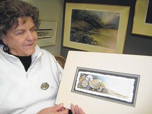 Ernestine Mynard Blanton is a watercolor artist, specializing in nature. Here, she shows off a painting a seashells at Ocracoke Island, N.C., on the Outer Banks. (Photo by Joe Tennis | Bristol Herald Courier)