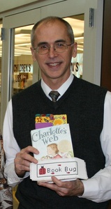 Bristol Library Director Jud Barry with some of the bookmarks and the children's classic "Charlotte's Web."