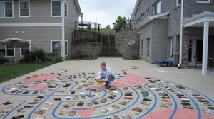 Margarte Gregg distributes gloves along the labyrinth at ElderSpirit in Abingdon, Va.