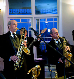 Playing saxophone, from left, are Dr. Sam Huddleston IV and Dr. Tom Huddleston.