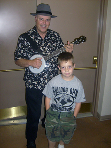 "Banjo Joe" Bevins at age six with his idol, David Holt.