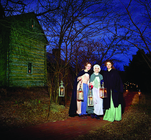 Young ladies light the way with lanterns during Rocky Mount's ACandlelight Christmas celebration.