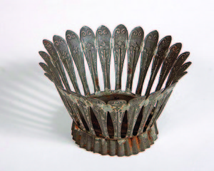 William was an artisan, specifically a tinsmith and coppersmith, making all sorts of high-demand household wares like candle molds, muffineers, pitchers, lanterns, and cheese molds ... or fanciful objects like the basket fashioned from spoons shown here.