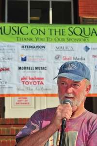 Steve Cook welcomes entertainers and crowds to Music on the Square.