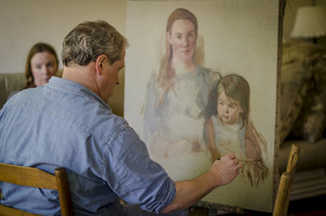 Tom Root painting a portrait (one of the models can be seen in the background). (Photo by Stephen Pyle)
