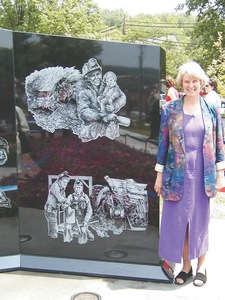 Ellen Elmes is seen here with her Coal Miner's Memorial in Richlands, Va.
