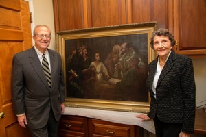 Elizabeth (Betty) Lincoln Francis, left, presented King University with a painting from her personal collection. "Jesus in the Temple" was painted by artist Margaret Elizabeth (Betty) King (1864-1943), the granddaughter of the founder of King College. Dr. Richard Ray, left, is interim president of King Universty. 