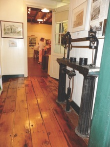 The hallway leads past studios to the Members Gallery at The Arts Depot, Abingdon, Va. The floors are original and have been refinished in part of the building.