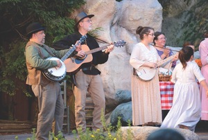 Joey O'Quinn (banjo), and Larry Mullins (guitar) play"Sourwood Mountain" during the homecoming scene in the 2013 season. (photo by Ron Flanary)