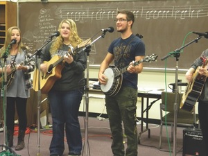Ashley Trager, on guitar and Caleb Hardin on banjo carry on the musical. 
