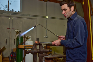Marc Maiorana works with metal in his studio in Abingdon, Virginia. (photo by David Grace)
