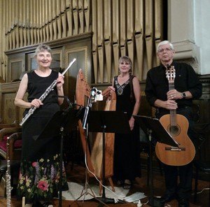 Charlotte Ellis (left), Sandra Parker (center) and Art Ellis (right) perform  at Willard Memorial Chapel, Auburn, New York.
