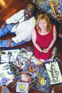 Brian and Marie Bridgeforth in their studio surrounded by some of their artwork. (photo by David Grace)
