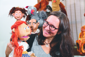 Heidi Rugg with some of her puppet creations (Kim Lee Photography)