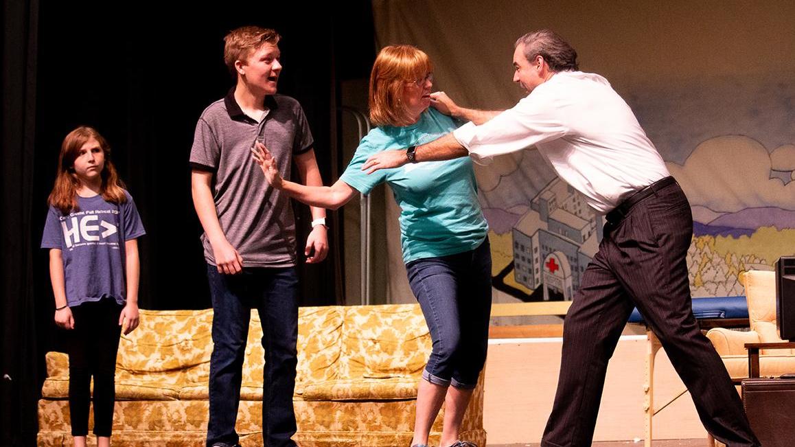 Left to right: Isabella Paysinger as Matilda Wormwood, Sandy Nienaber as Mrs. Wormwood, Jeff Ward as Mr. Wormwood and Eli Berney as Michael Wormwood perform a scene for 'Matilda the Musical.'