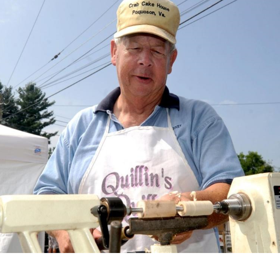 Charlie Quillin plies his craft during a festival.