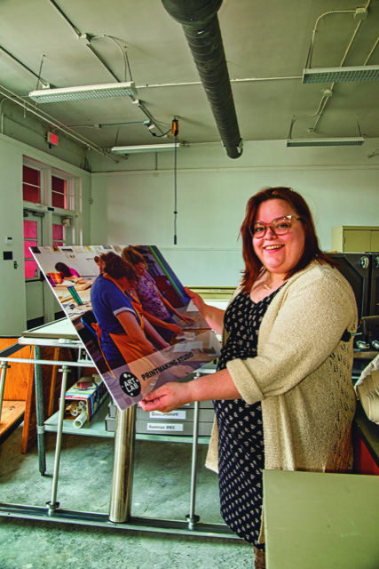 Laken Bridges with the equipment for the new printmaking studio