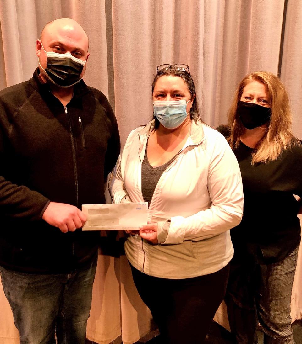 Suzanne Greene, center, a Walmart employee and longtime Tusculum Arts Outreach volunteer, presents the check to Brian Ricker, left, and Jennifer Hollowell of Arts Outreach.