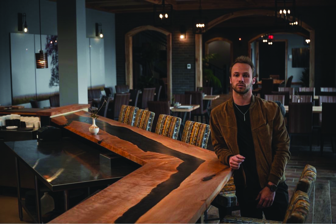 Justin VanHoy with his big leaf maple three section 33' dining bar