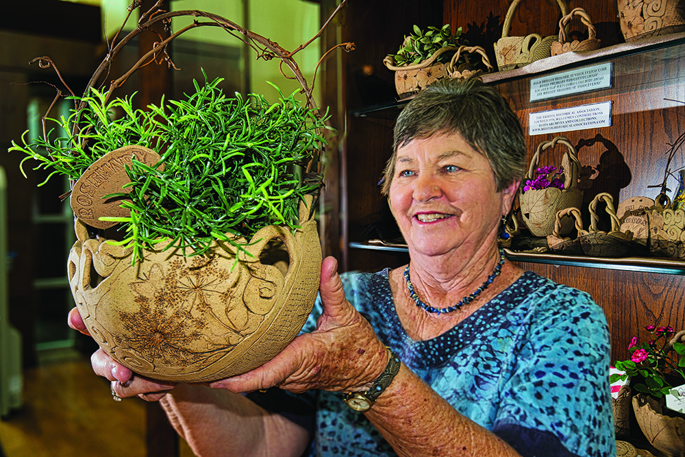 Mary Curtin with a Queen Anne's lace patterned basket (photo by David Grace)